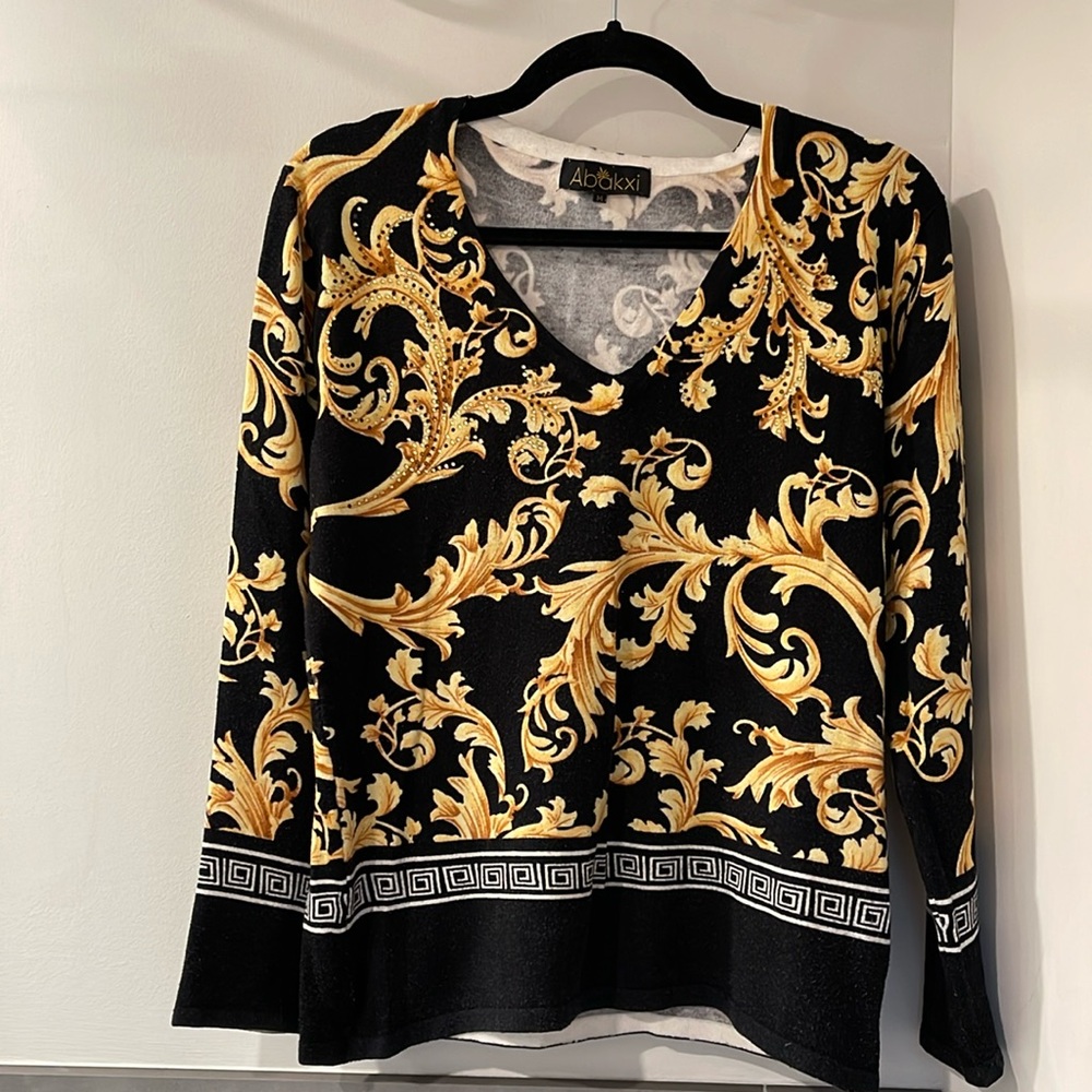 Sweater top with golden leaves pattern